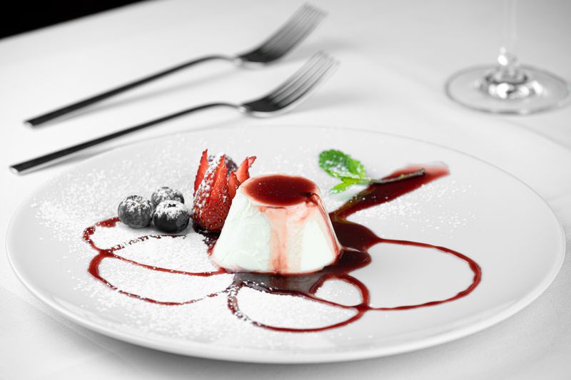 Panna cotta Italian dessert with berry sauce